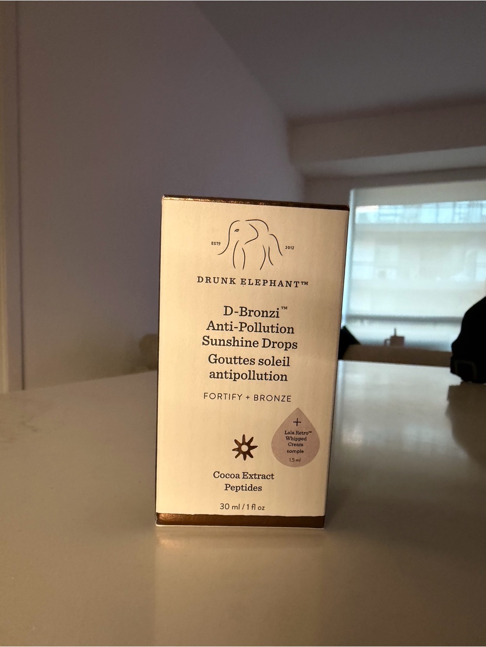 Drunk Elephant D-Bronzi Anti-Pollution Sunshine Drops – White & Bronze Accents